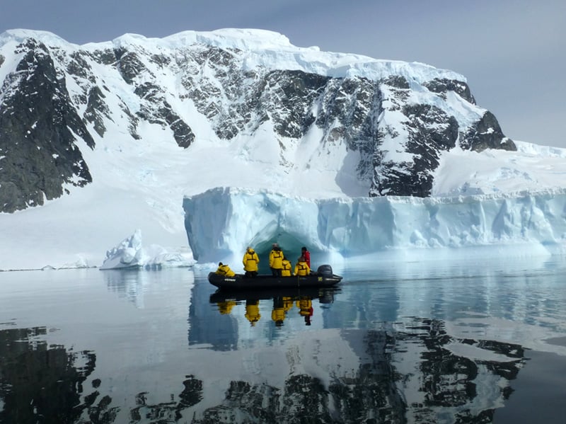 Passengers in Antarctica enjoy the spectacular views from the surface of the water while Zodiac cruising.